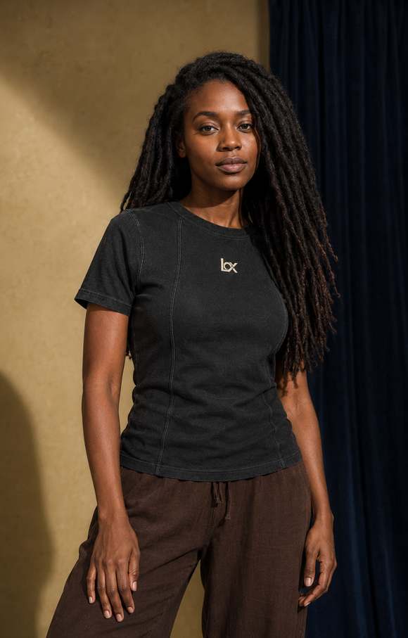 Woman wearing the black LOX shirt in a warm setting