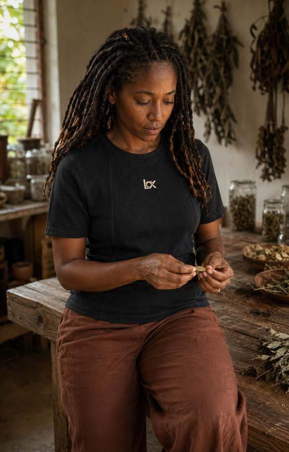 Woman wearing a fitted LOX shirt in a workshop